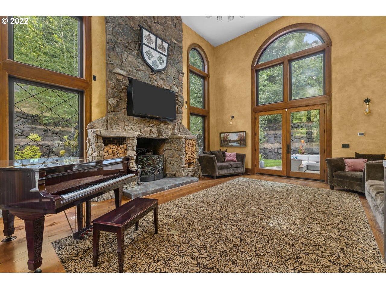 14125 Northwest Germantown Road Portland, OR 97231 - Photo 11 of 32 a living room with furniture a fireplace and a floor to ceiling window