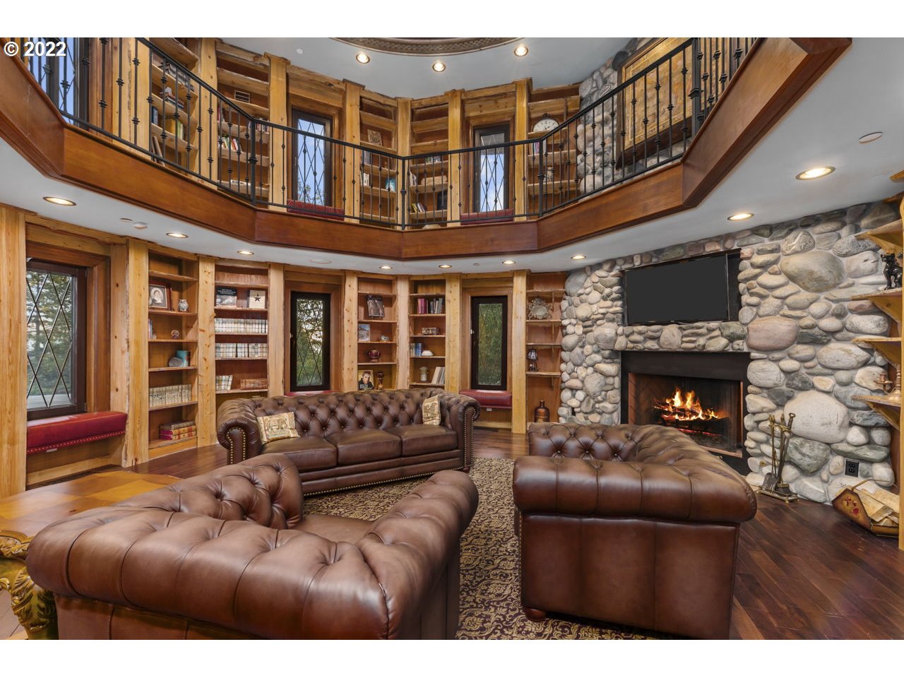 14125 Northwest Germantown Road Portland, OR 97231 - Photo 13 of 32 a living room with furniture a fireplace and a flat screen tv