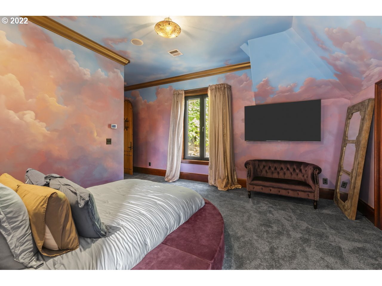 14125 Northwest Germantown Road Portland, OR 97231 - Photo 26 of 32 a bedroom with a bed and a flat tv screen on dresser