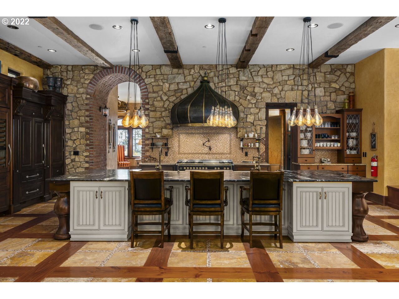 14125 Northwest Germantown Road Portland, OR 97231 - Photo 8 of 32 a kitchen with granite countertop a stove a sink and a microwave