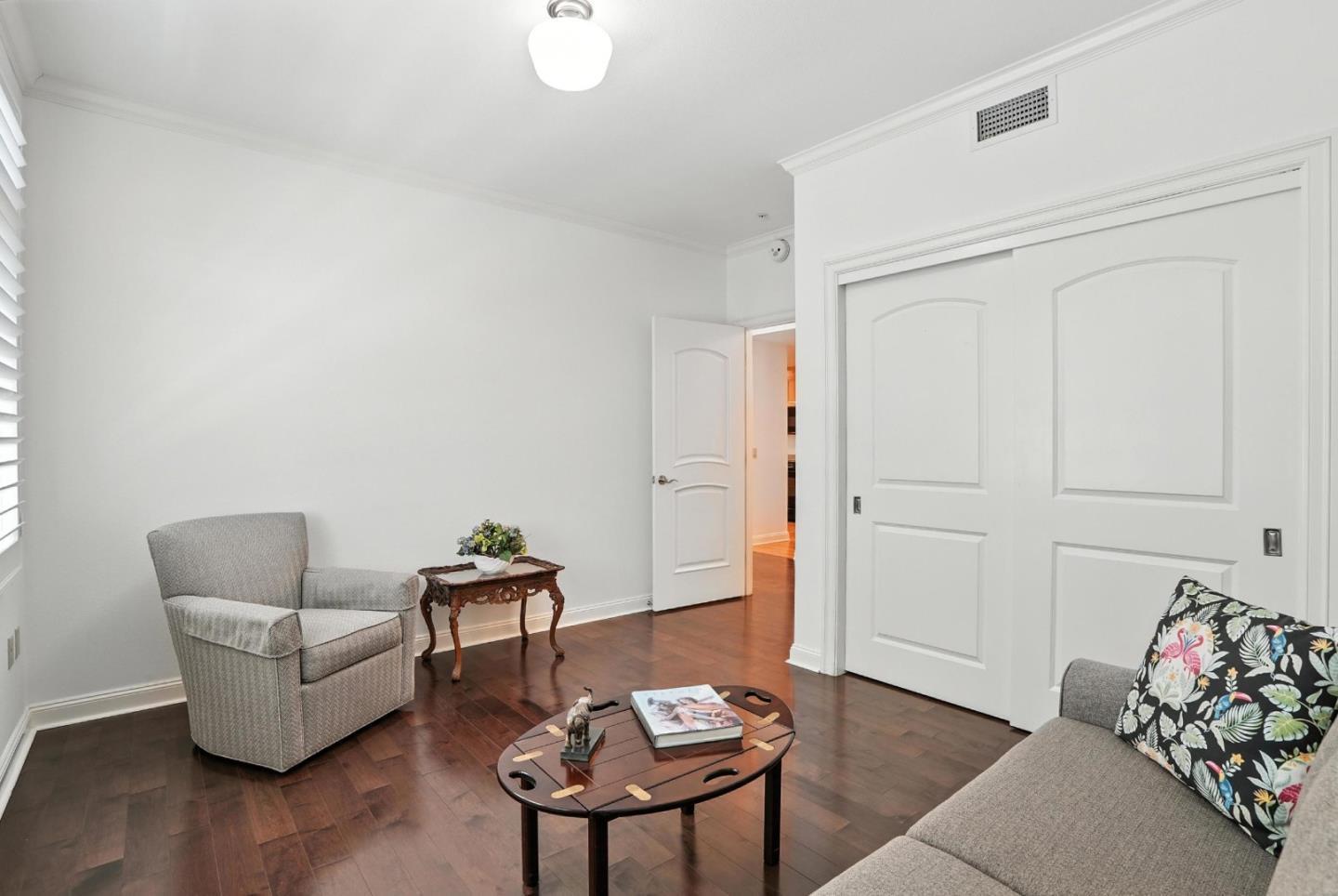 10 Crystal Springs Road, Unit 1507 San Mateo, CA 94402 - Photo 19 of 33 a living room with furniture and wooden floor