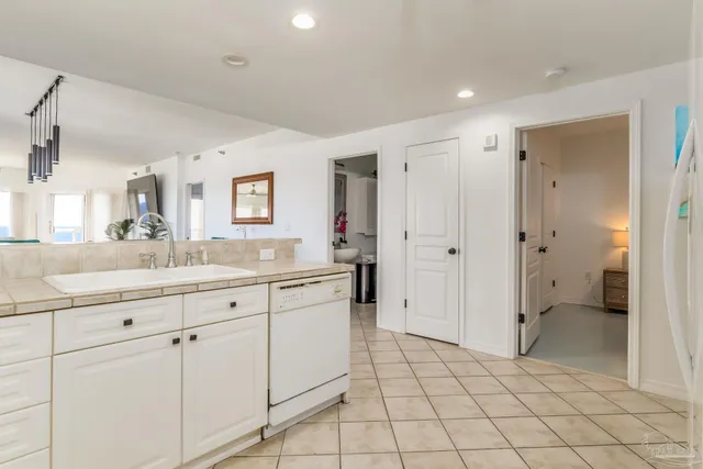 a spacious bathroom with a granite countertop sink mirror and shower