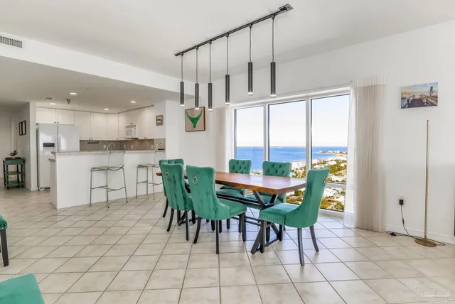 a view of a dining room with furniture window and outside view