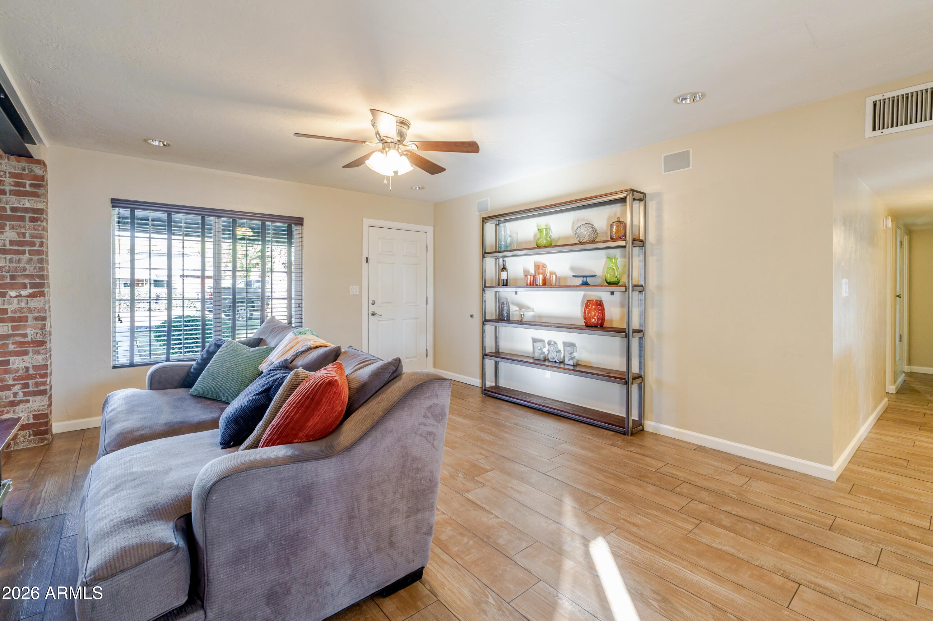1631 West Rovey Avenue Phoenix, AZ 85015 - Photo 11 of 46 a living room with furniture and a window