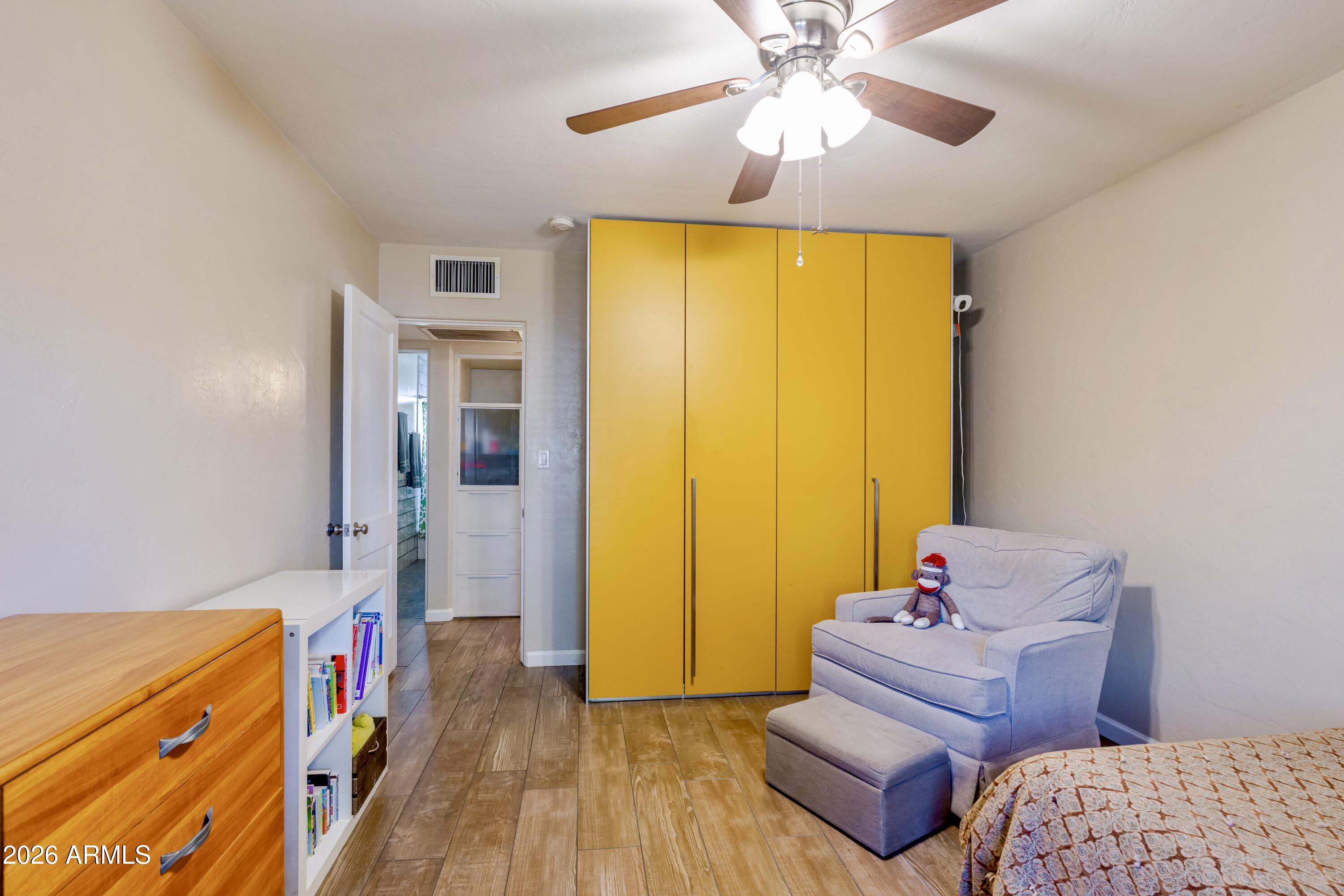 1631 West Rovey Avenue Phoenix, AZ 85015 - Photo 21 of 46 a bed room with a bed and a window