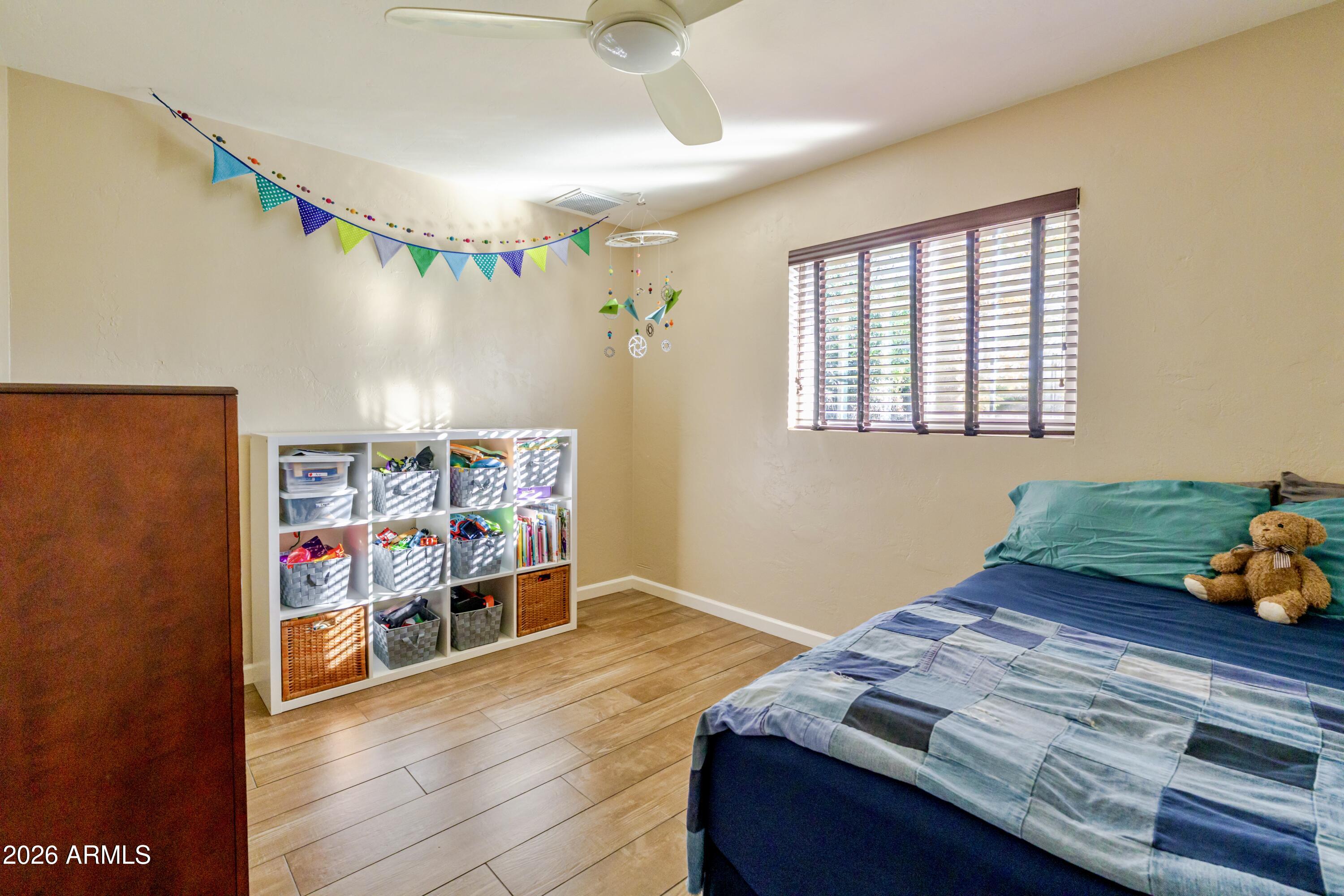 1631 West Rovey Avenue Phoenix, AZ 85015 - Photo 27 of 46 a room with furniture and a book shelf