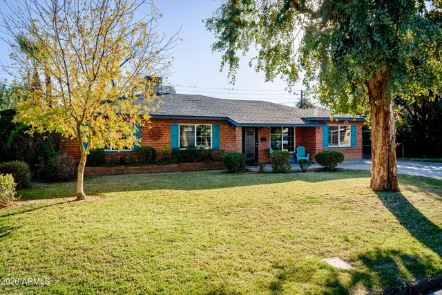 a view of house with a swimming pool