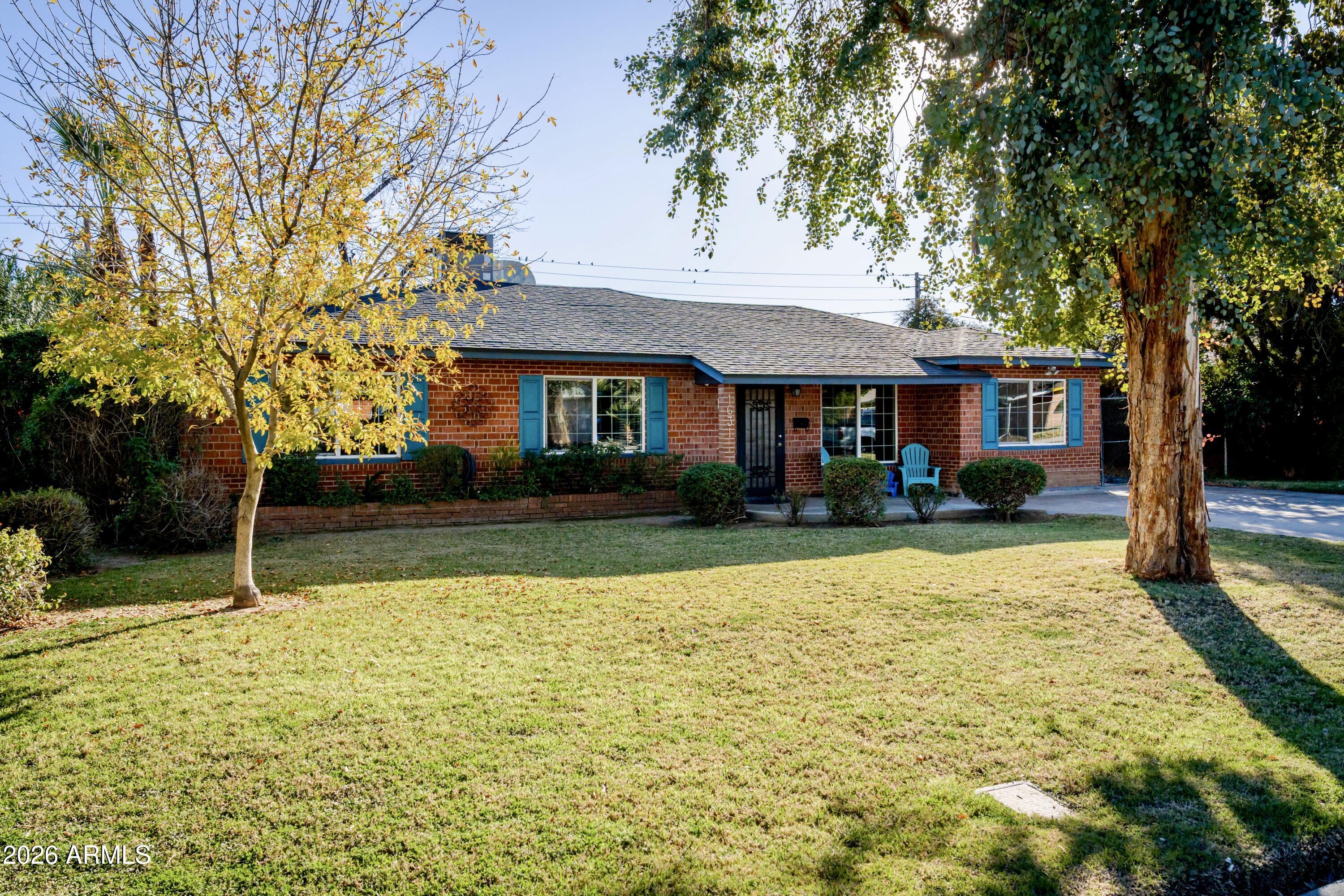 1631 West Rovey Avenue Phoenix, AZ 85015 - Photo 3 of 46 a view of house with a swimming pool