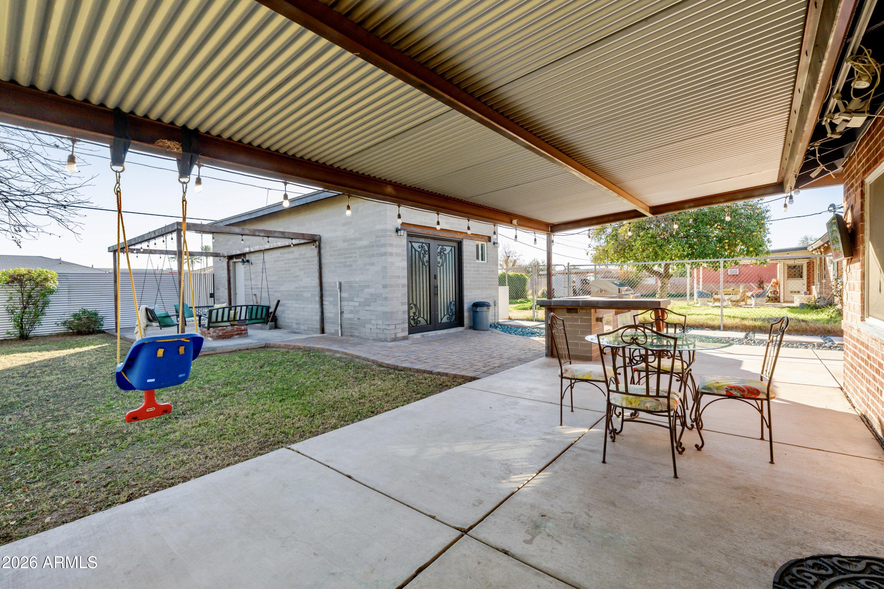 1631 West Rovey Avenue Phoenix, AZ 85015 - Photo 31 of 46 a view of a backyard with sitting area