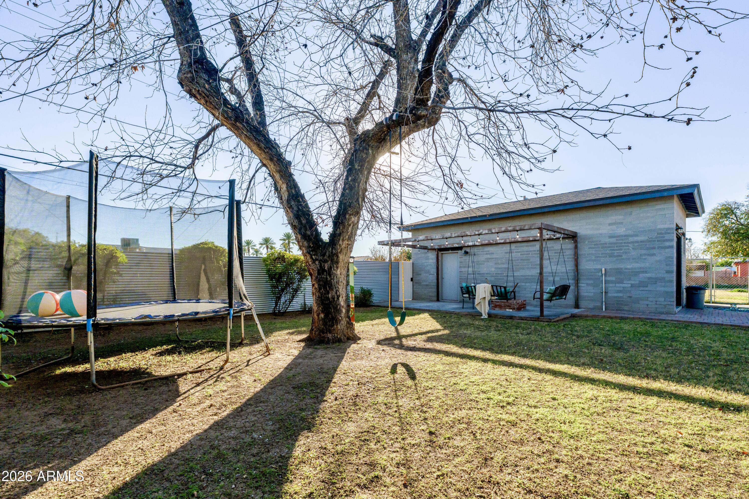 1631 West Rovey Avenue Phoenix, AZ 85015 - Photo 38 of 46 a view of a house with backyard and sitting area