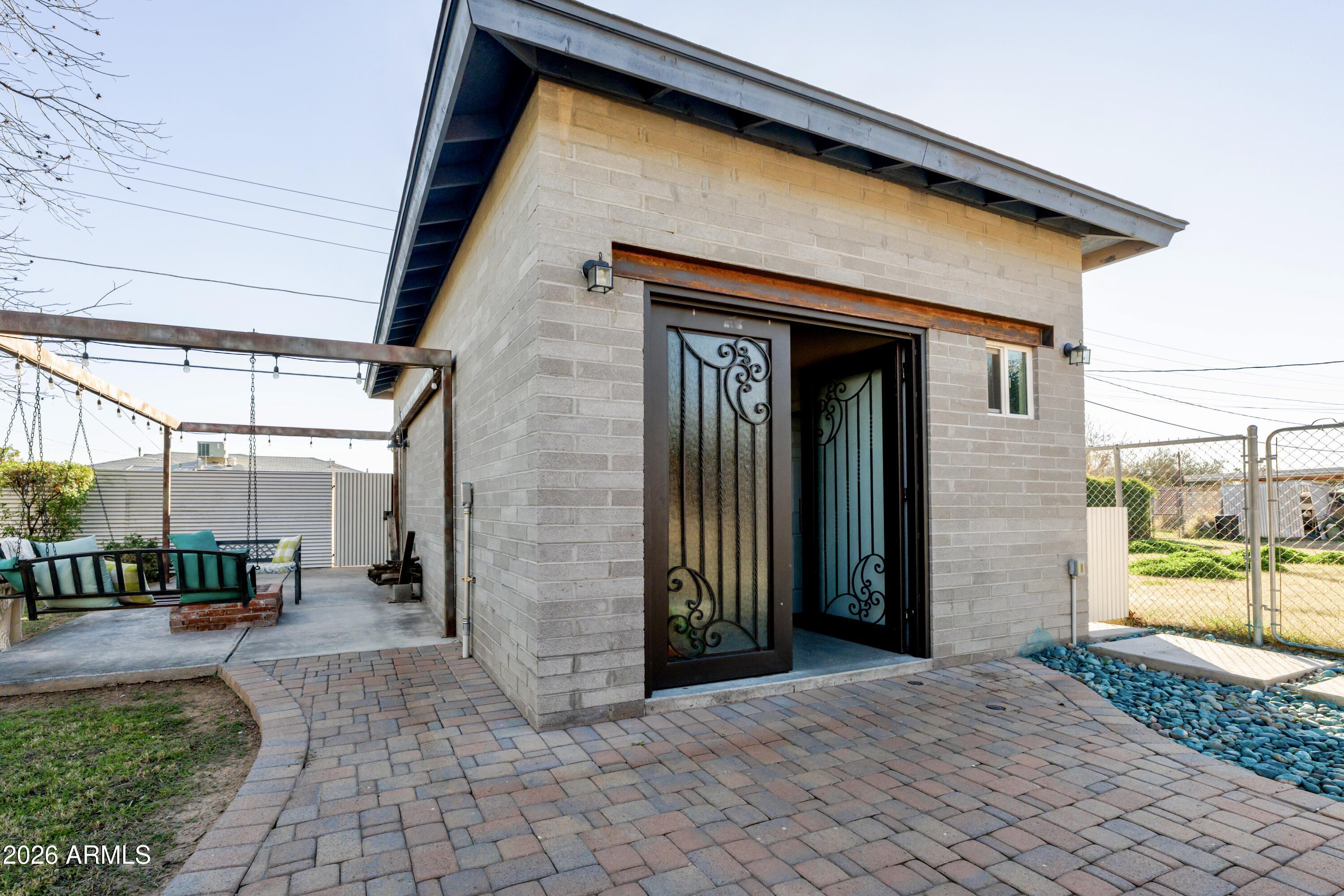 1631 West Rovey Avenue Phoenix, AZ 85015 - Photo 39 of 46 a view of a patio with table and chairs