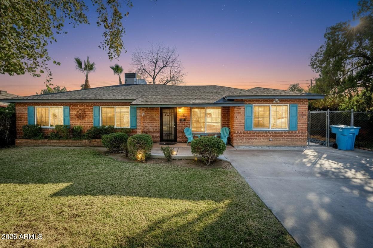 1631 West Rovey Avenue Phoenix, AZ 85015 - Photo 43 of 46 a view of a house with backyard and garden