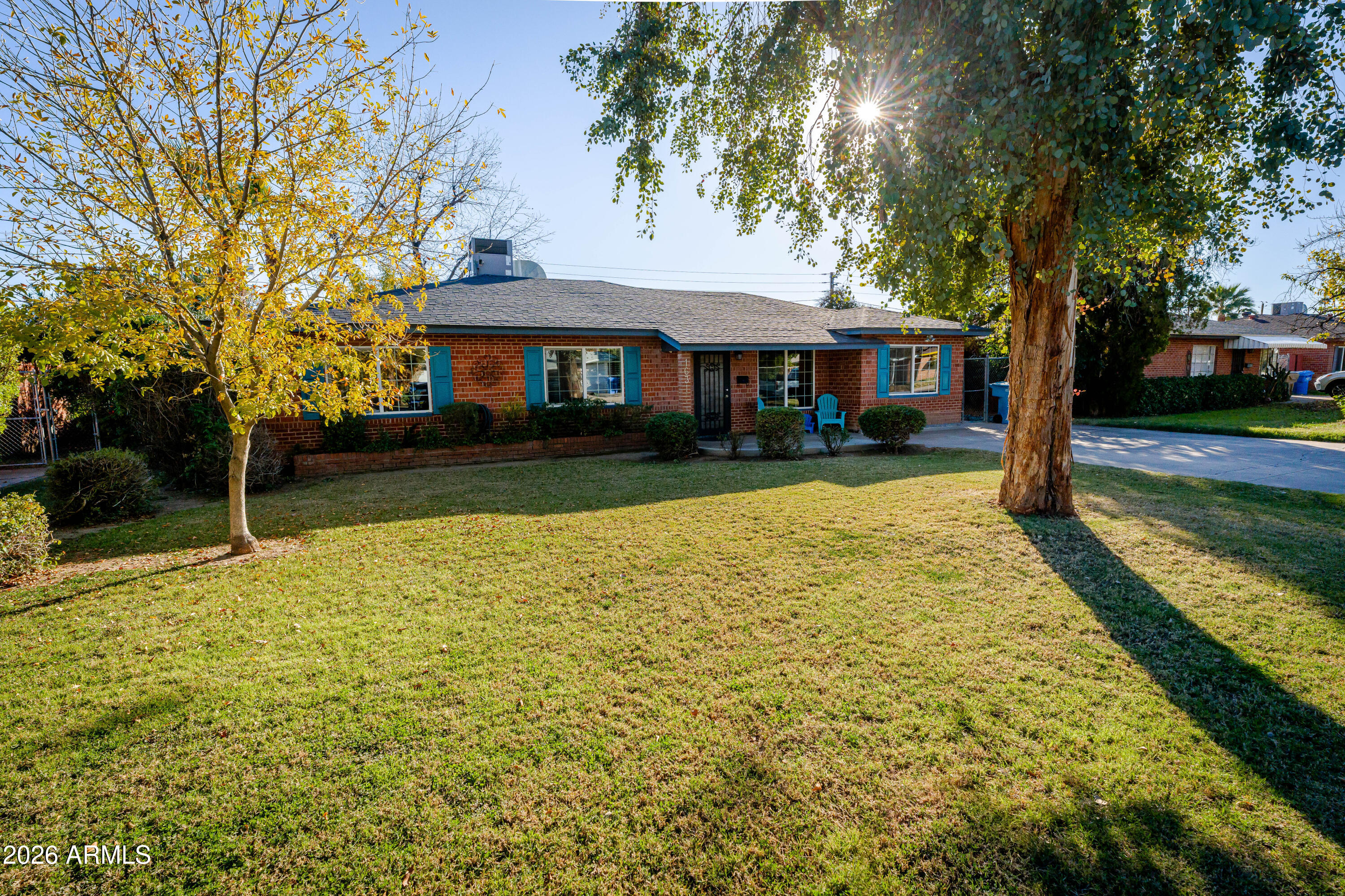 1631 West Rovey Avenue Phoenix, AZ 85015 - Photo 5 of 46 a view of a house with a yard