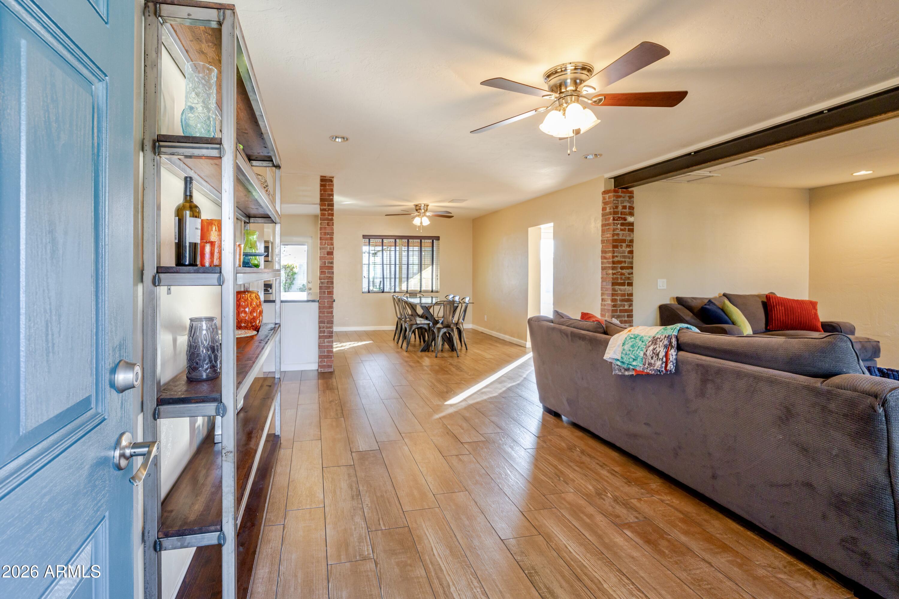 1631 West Rovey Avenue Phoenix, AZ 85015 - Photo 7 of 46 a living room with furniture and wooden floor