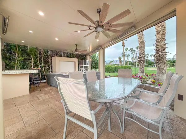 a large white kitchen with a large window