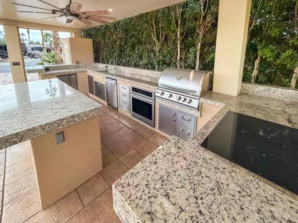 a view of a house with a backyard and a garage