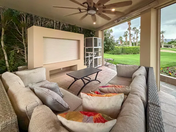 a outdoor dining space with furniture and outdoor view