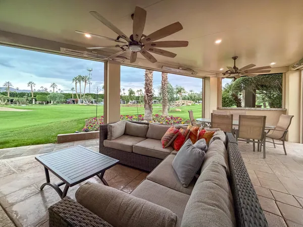 a large white kitchen with a large window
