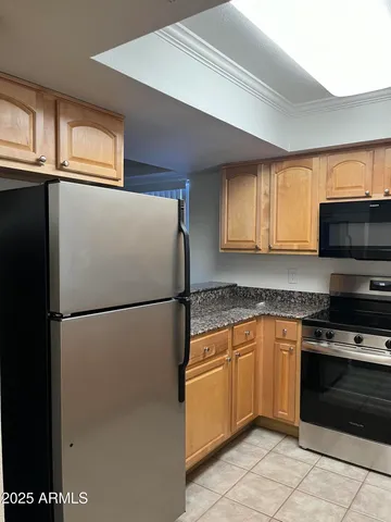 a white refrigerator freezer sitting inside of a kitchen
