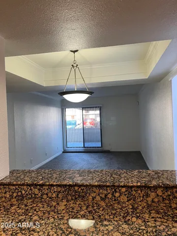 a kitchen with stainless steel appliances granite countertop a sink and a wooden cabinets