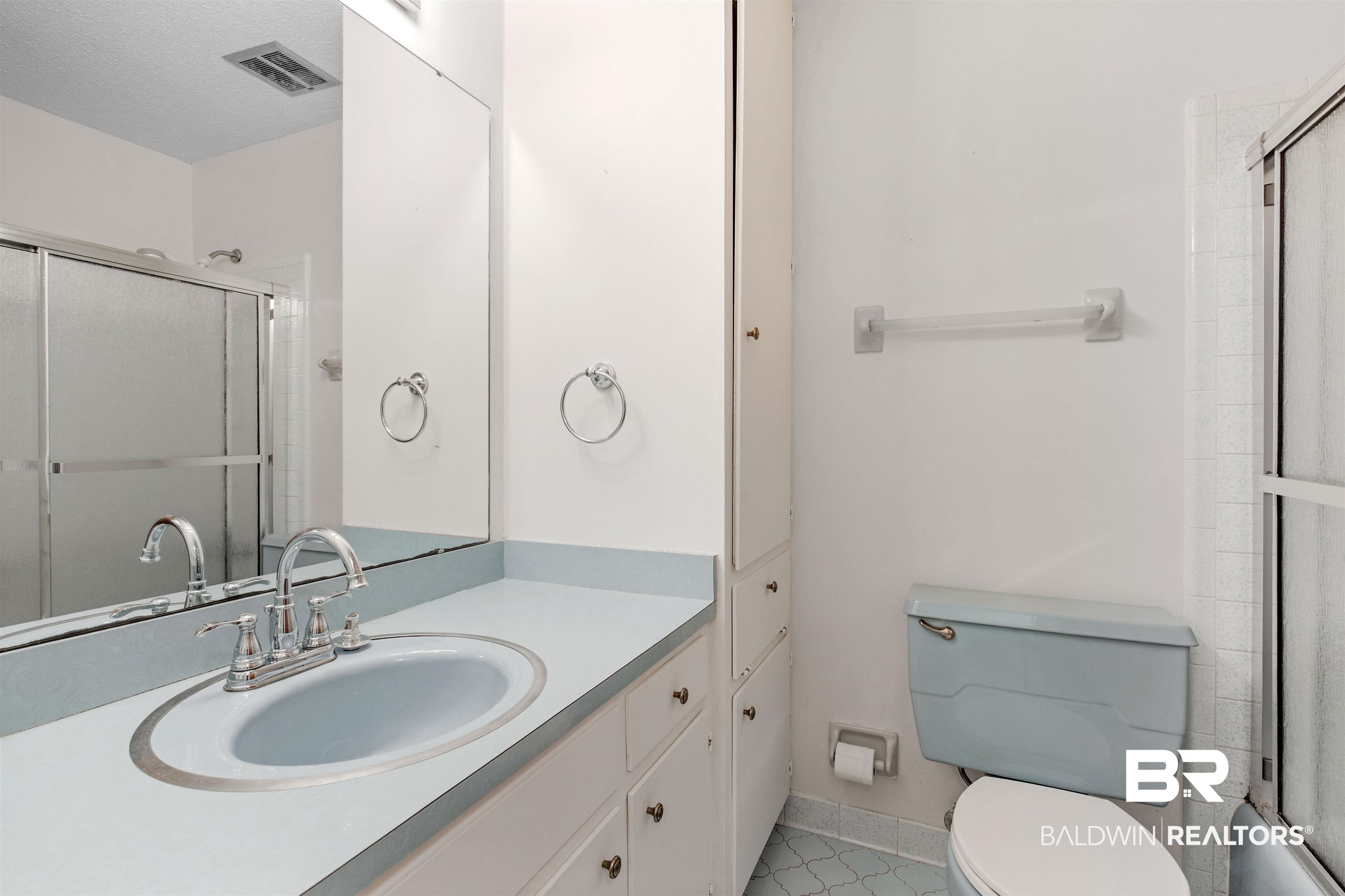 2007 Grider Road Mobile, AL 36618 - Photo 12 of 20 Bathroom with toilet, vanity, visible vents, and baseboards