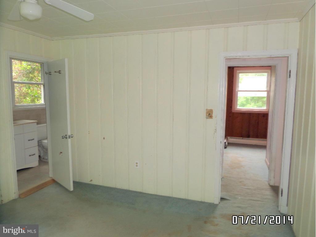 608 Cliveden Road Baltimore, MD 21208 - Photo 7 of 23 a view of an empty room and bathroom