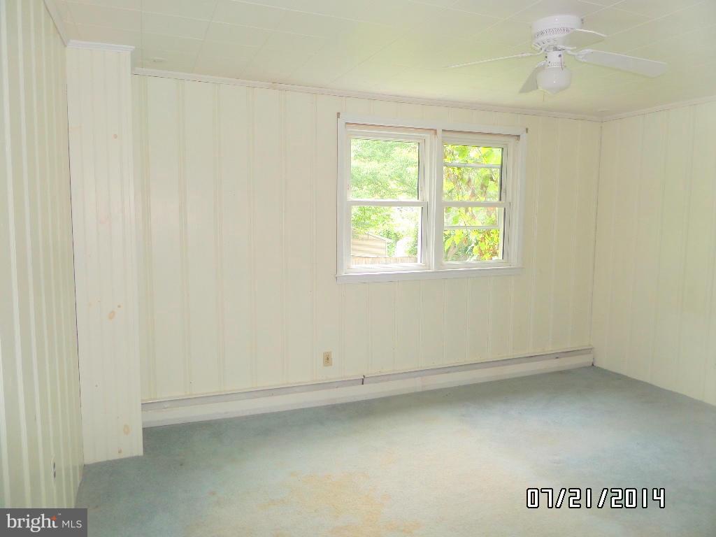 608 Cliveden Road Baltimore, MD 21208 - Photo 8 of 23 an empty room with a window