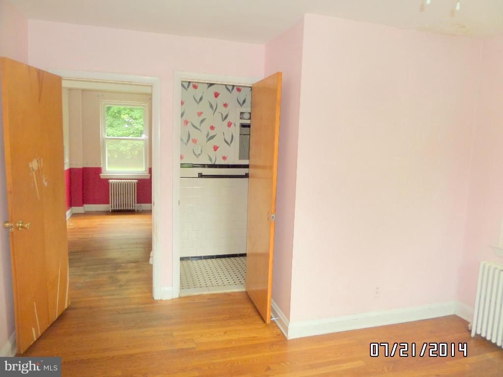 608 Cliveden Road Baltimore, MD 21208 - Photo 10 of 23 a view of a kitchen with wooden floor