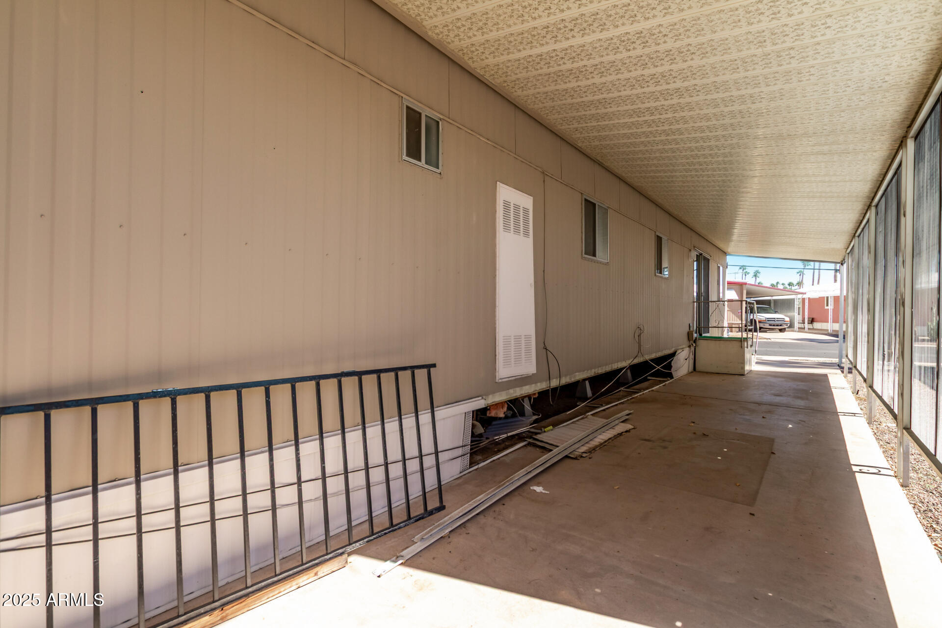 303 South Recker Road, Unit 200 Mesa, AZ 85206 - Photo 27 of 29 a view of a street with wooden fence