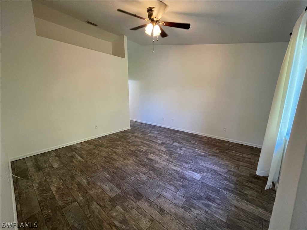 5568-5570 Judith Road Bokeelia, FL 33922 - Photo 12 of 22 a view of a room with wooden floor