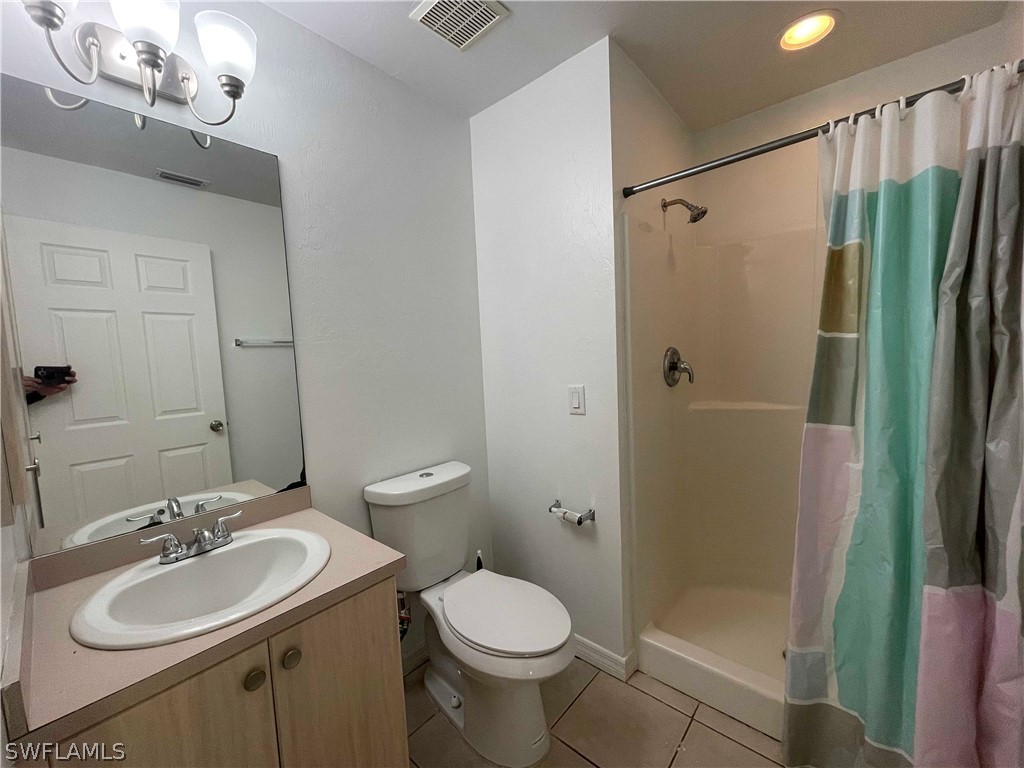 5568-5570 Judith Road Bokeelia, FL 33922 - Photo 19 of 22 a bathroom with a sink toilet and shower