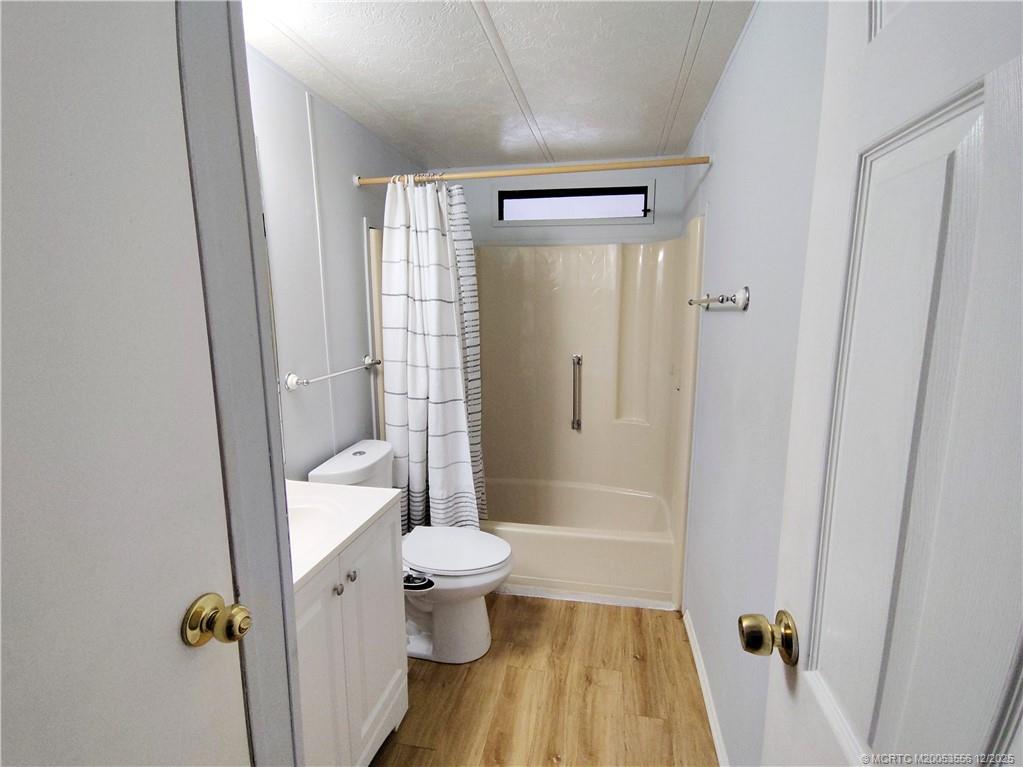2581 Southwest Pontiac Place Stuart, FL 34997 - Photo 29 of 62 a bathroom with a shower toilet and sink