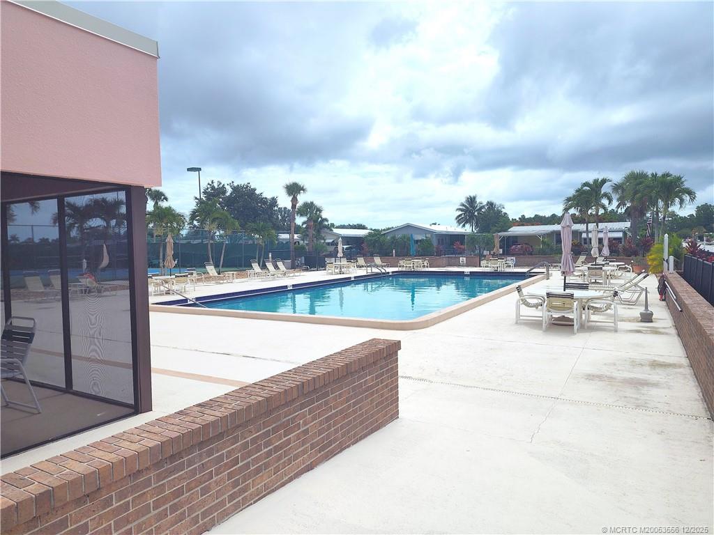 2581 Southwest Pontiac Place Stuart, FL 34997 - Photo 53 of 62 a view of swimming pool with outdoor seating and city view