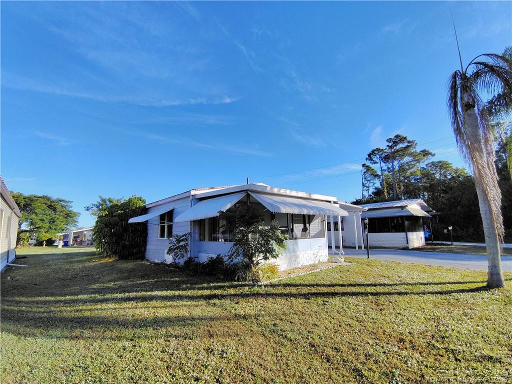 2581 Southwest Pontiac Place Stuart, FL 34997 - Photo 8 of 62 a view of a swimming pool with house
