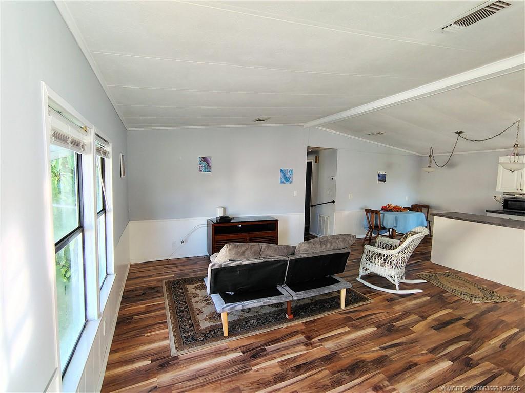 2581 Southwest Pontiac Place Stuart, FL 34997 - Photo 10 of 62 a work room with furniture and wooden floor