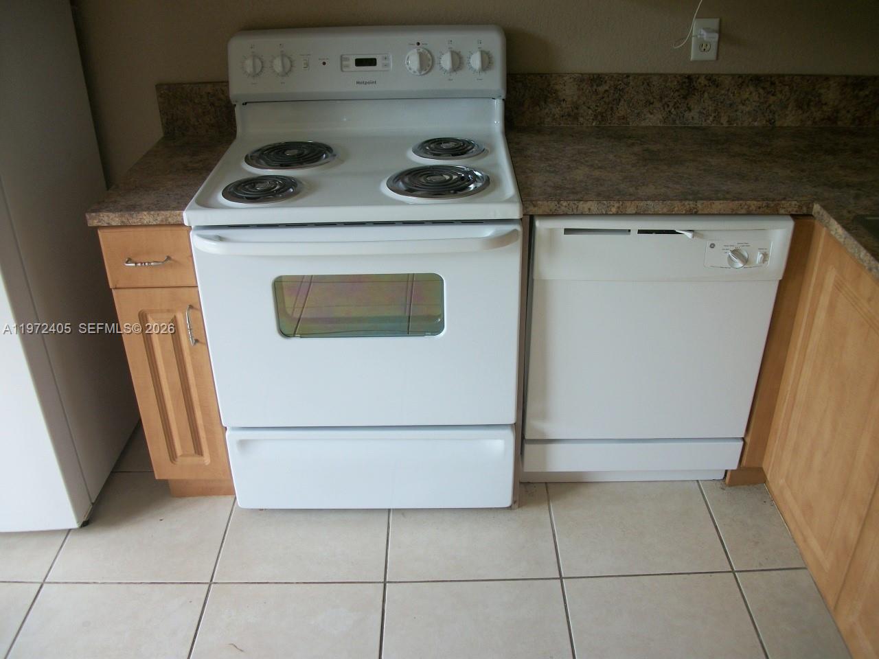 136 Southwest 15th Terrace Homestead, FL 33030 - Photo 12 of 37 a utility room with dryer and washer