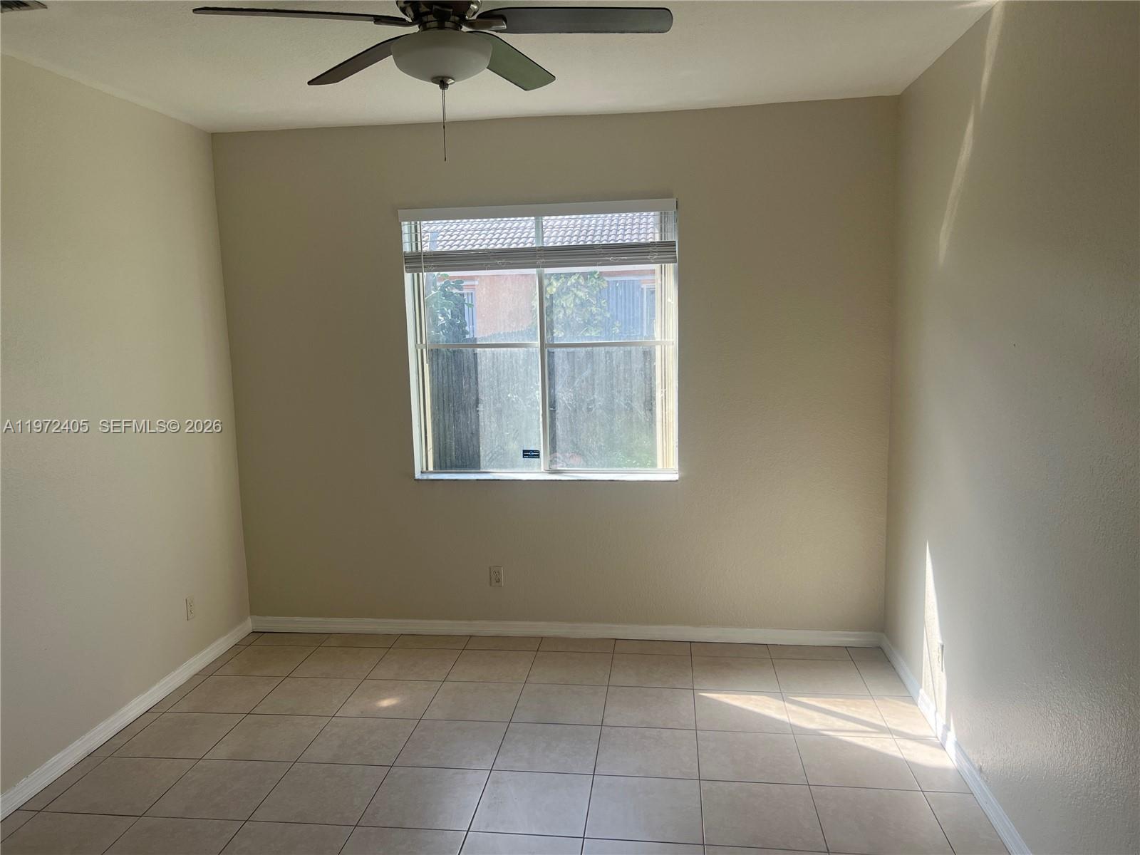 136 Southwest 15th Terrace Homestead, FL 33030 - Photo 18 of 37 a view of an empty room with a window