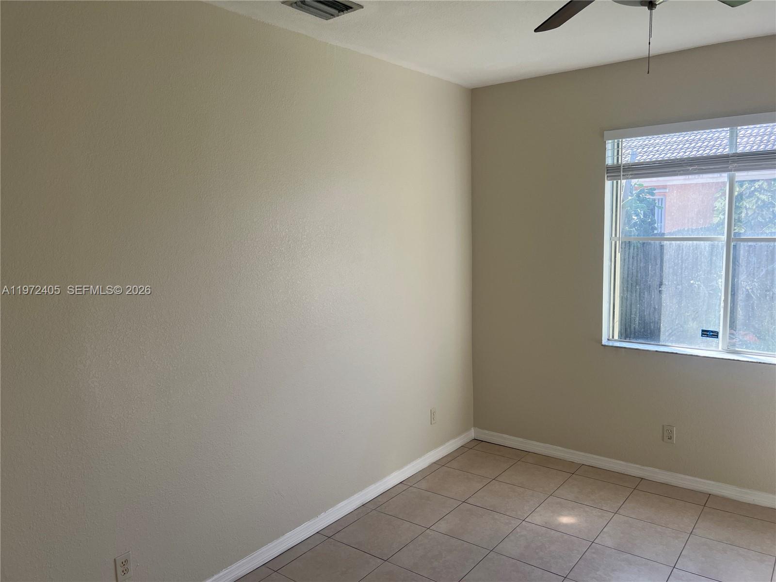 136 Southwest 15th Terrace Homestead, FL 33030 - Photo 20 of 37 a view of an empty room with a window