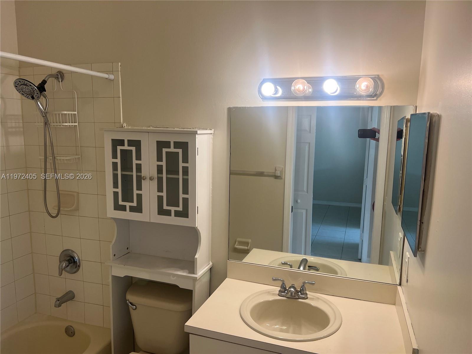 136 Southwest 15th Terrace Homestead, FL 33030 - Photo 22 of 37 a bathroom with a sink a toilet and shower