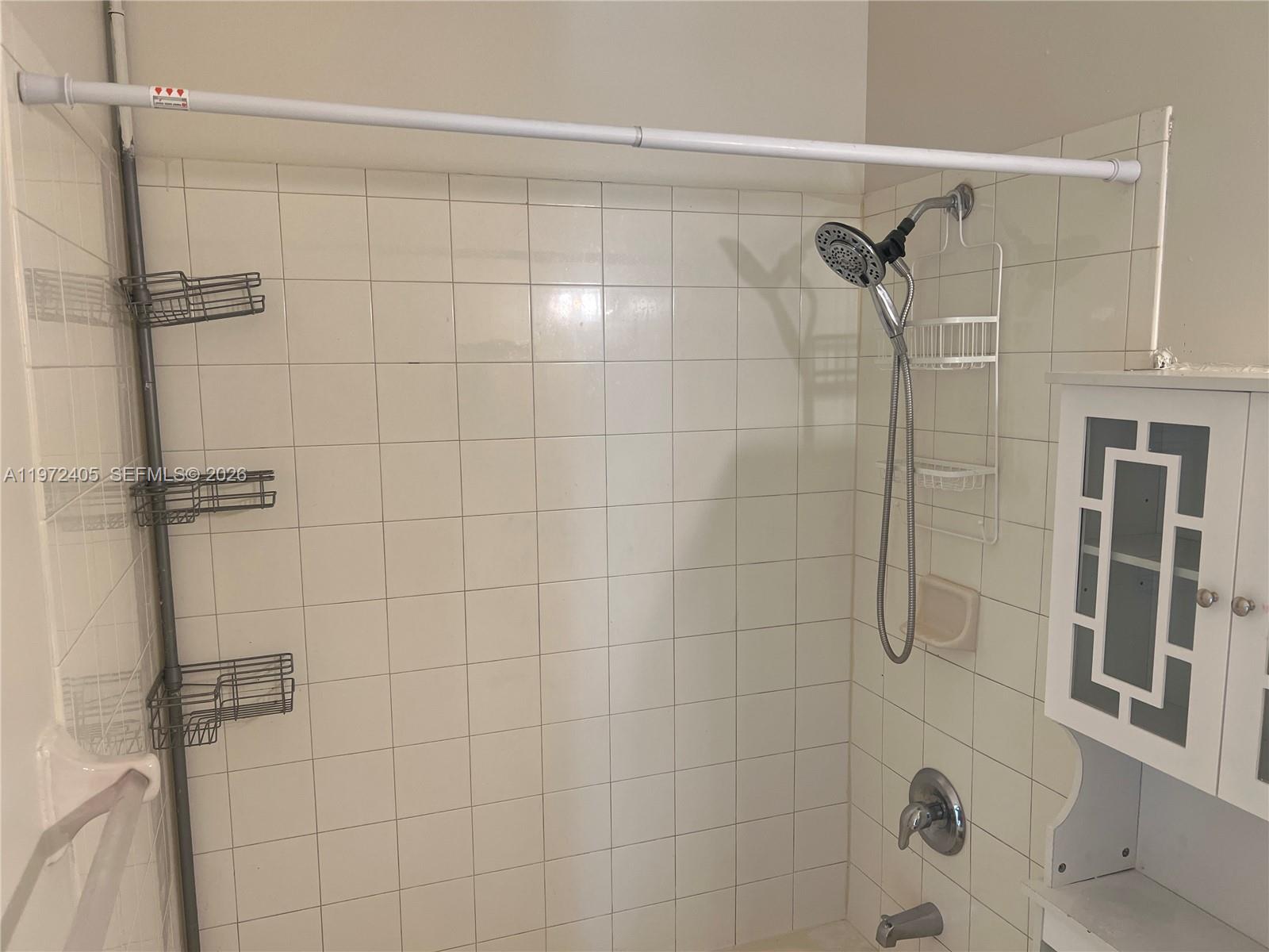 136 Southwest 15th Terrace Homestead, FL 33030 - Photo 24 of 37 a bathroom with a shower