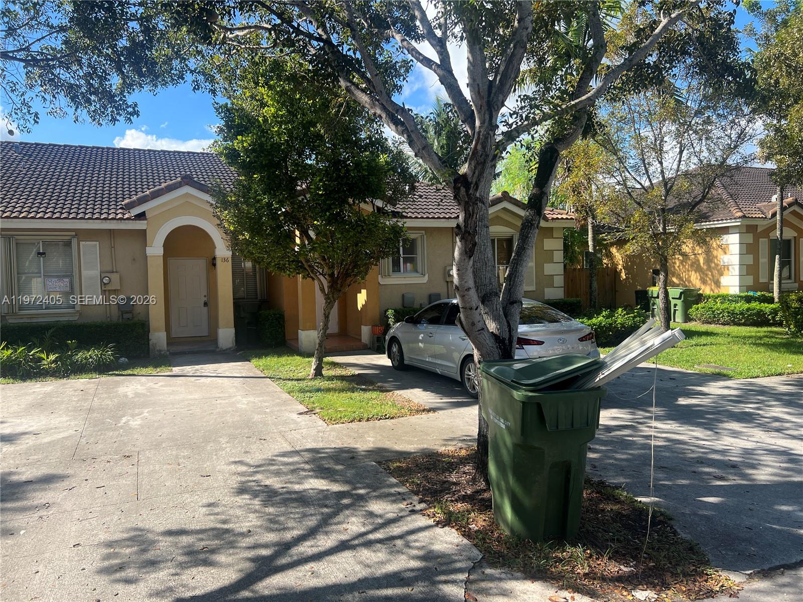 136 Southwest 15th Terrace Homestead, FL 33030 - Photo 3 of 37 a view of a house with backyard and a tree