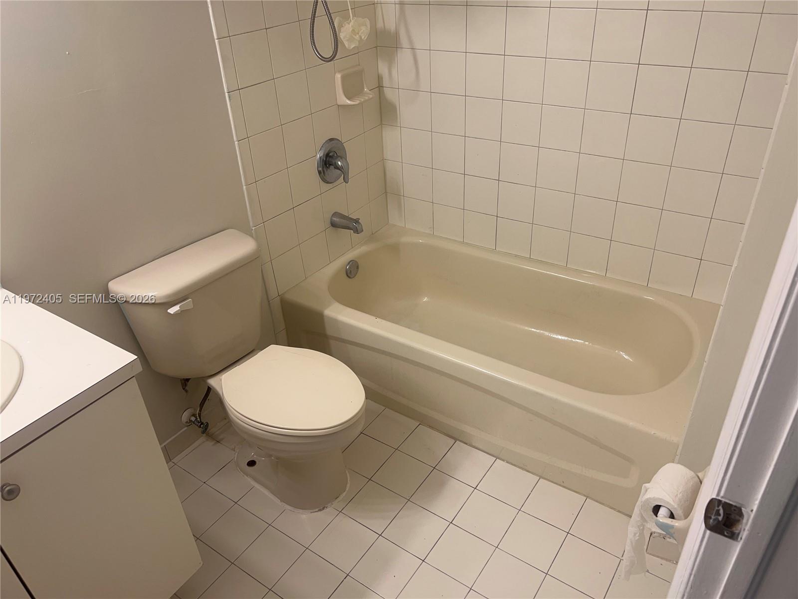 136 Southwest 15th Terrace Homestead, FL 33030 - Photo 33 of 37 a bathroom with a toilet and bathtub