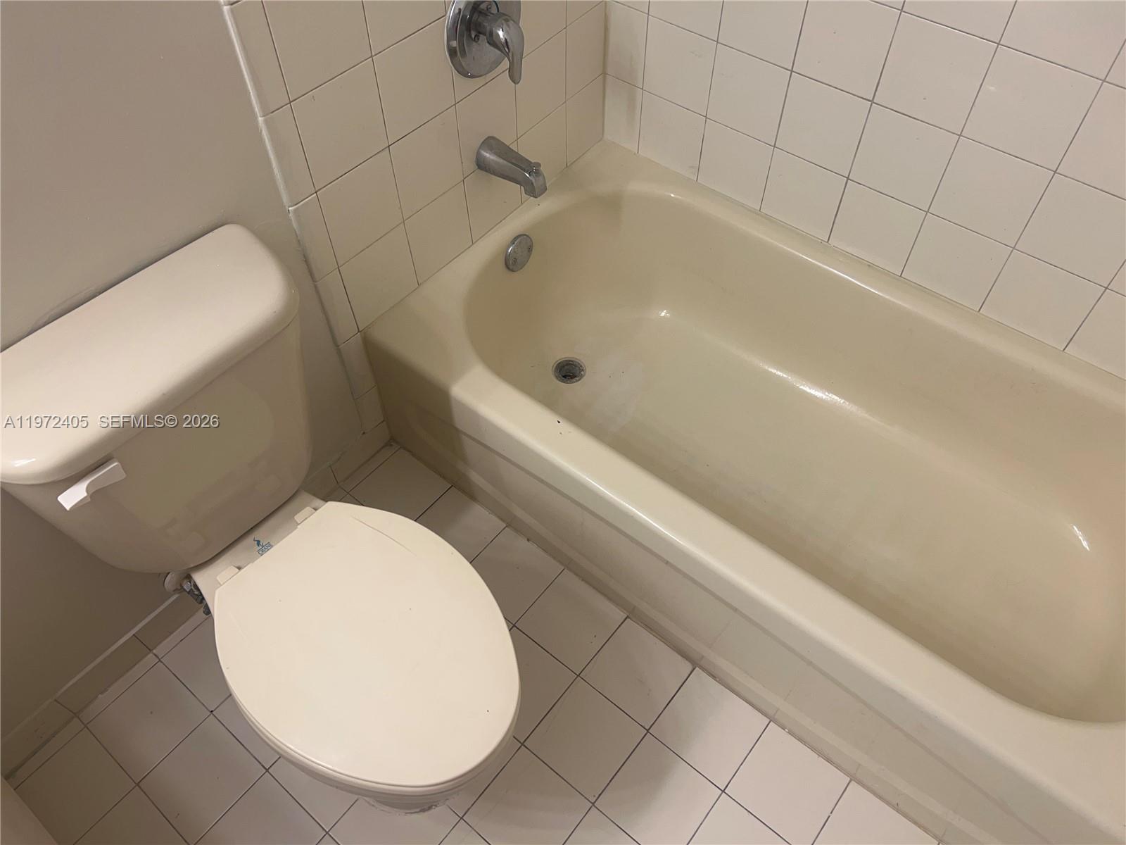136 Southwest 15th Terrace Homestead, FL 33030 - Photo 35 of 37 a bathroom with a toilet and bathtub