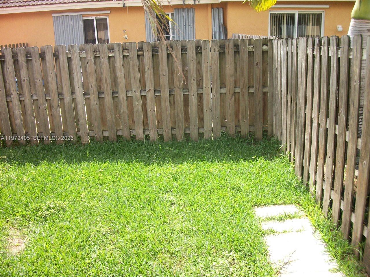 136 Southwest 15th Terrace Homestead, FL 33030 - Photo 6 of 37 a view of a backyard with potted plants