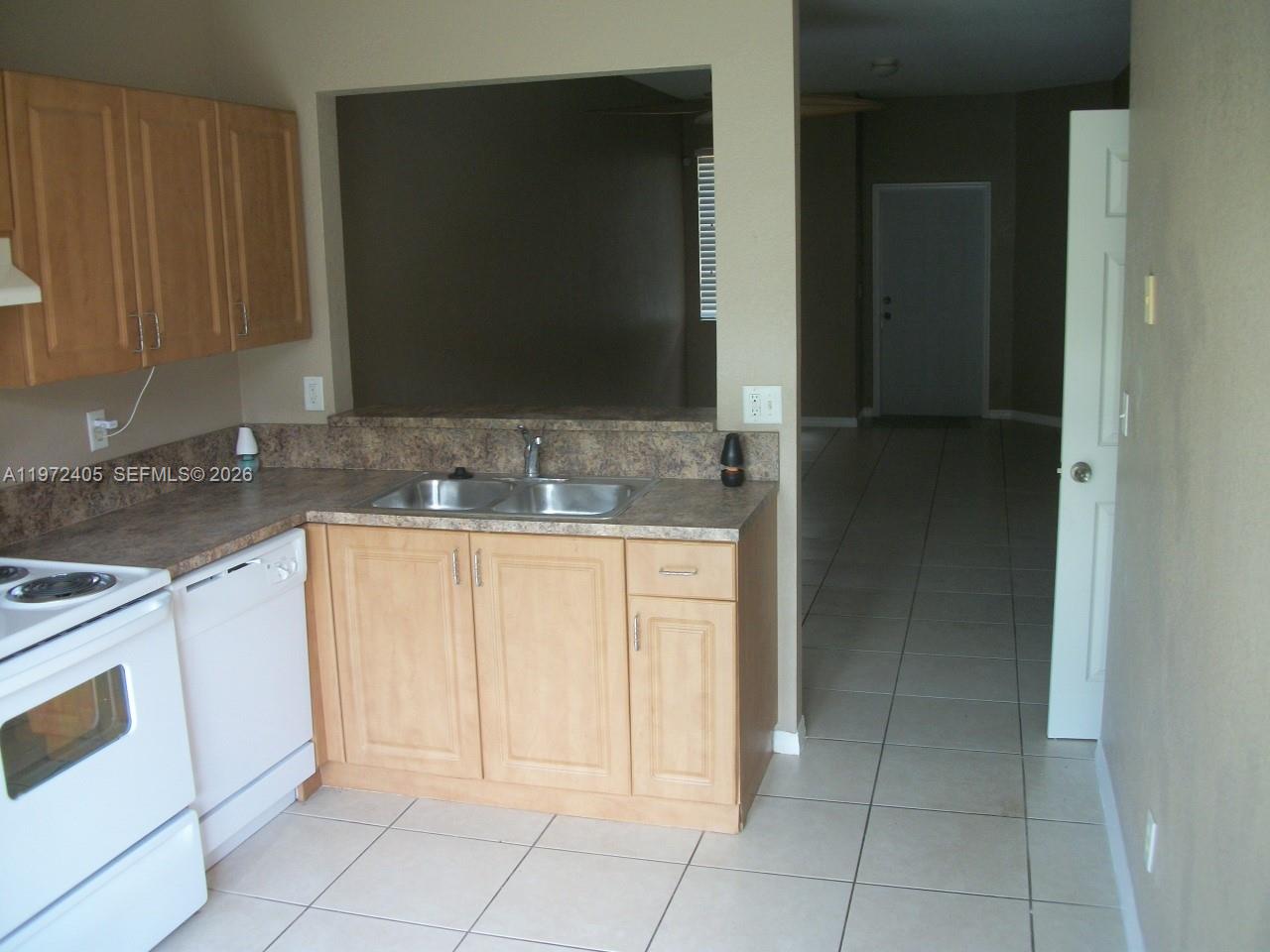 136 Southwest 15th Terrace Homestead, FL 33030 - Photo 10 of 37 a bathroom with a sink and a mirror