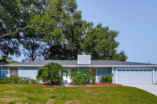 front view of a house with a yard