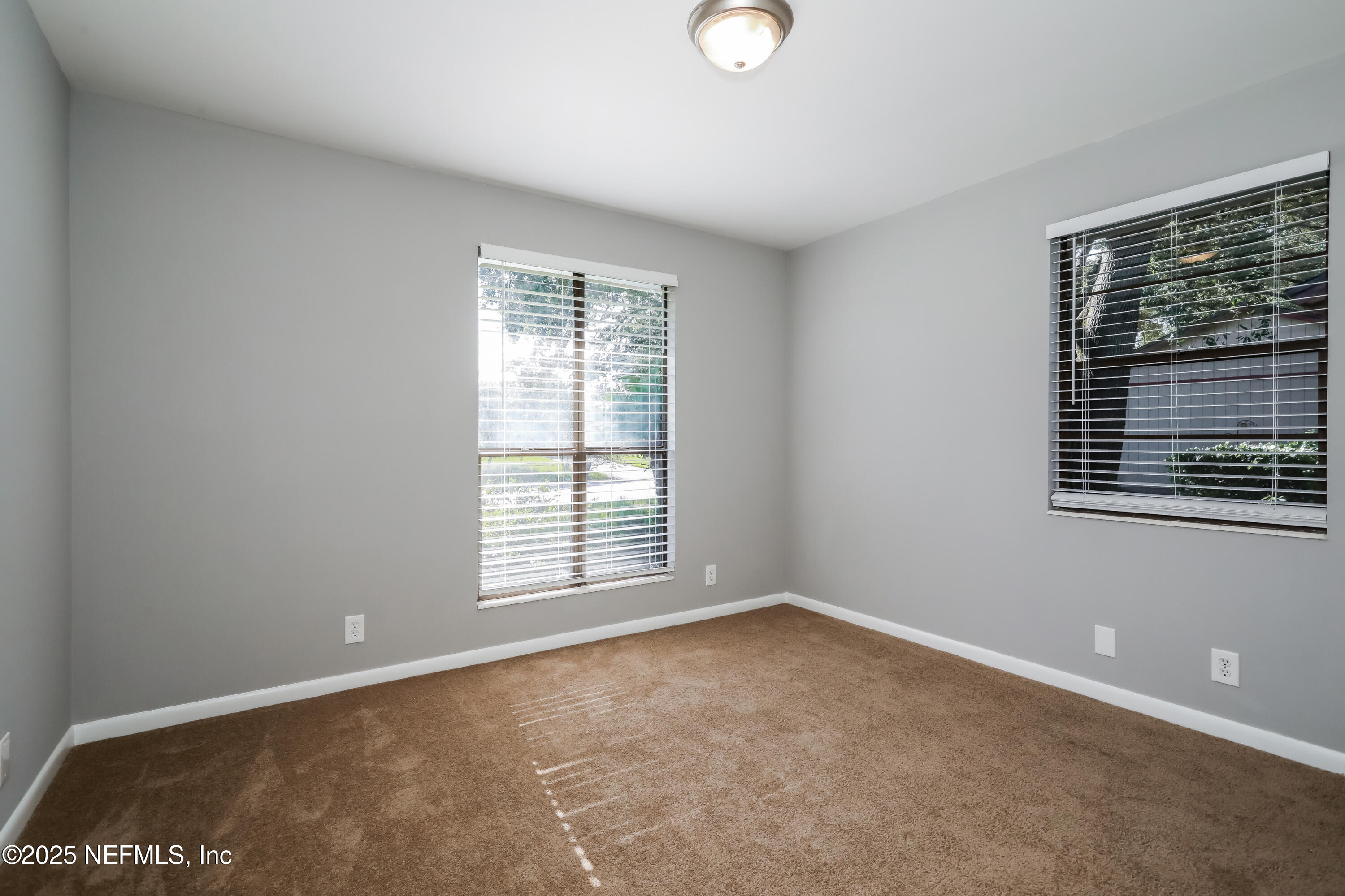 8408 Rampart Road Jacksonville, FL 32244 - Photo 11 of 15 a view of an empty room with a window