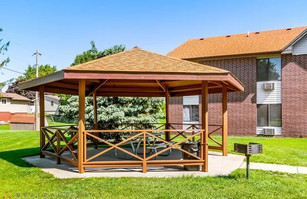 a view of a backyard with table and chairs