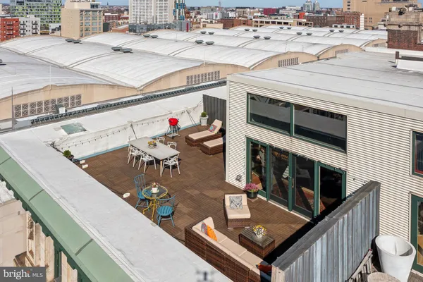 a view of roof deck with sitting area