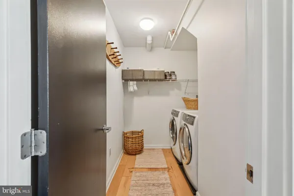 a view of hallway with washer and dryer